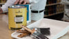 Painting contractor purchasing Benjamin Moore ceiling paint, paint brushes, and paint trays at John Boyle Decorating Centers.