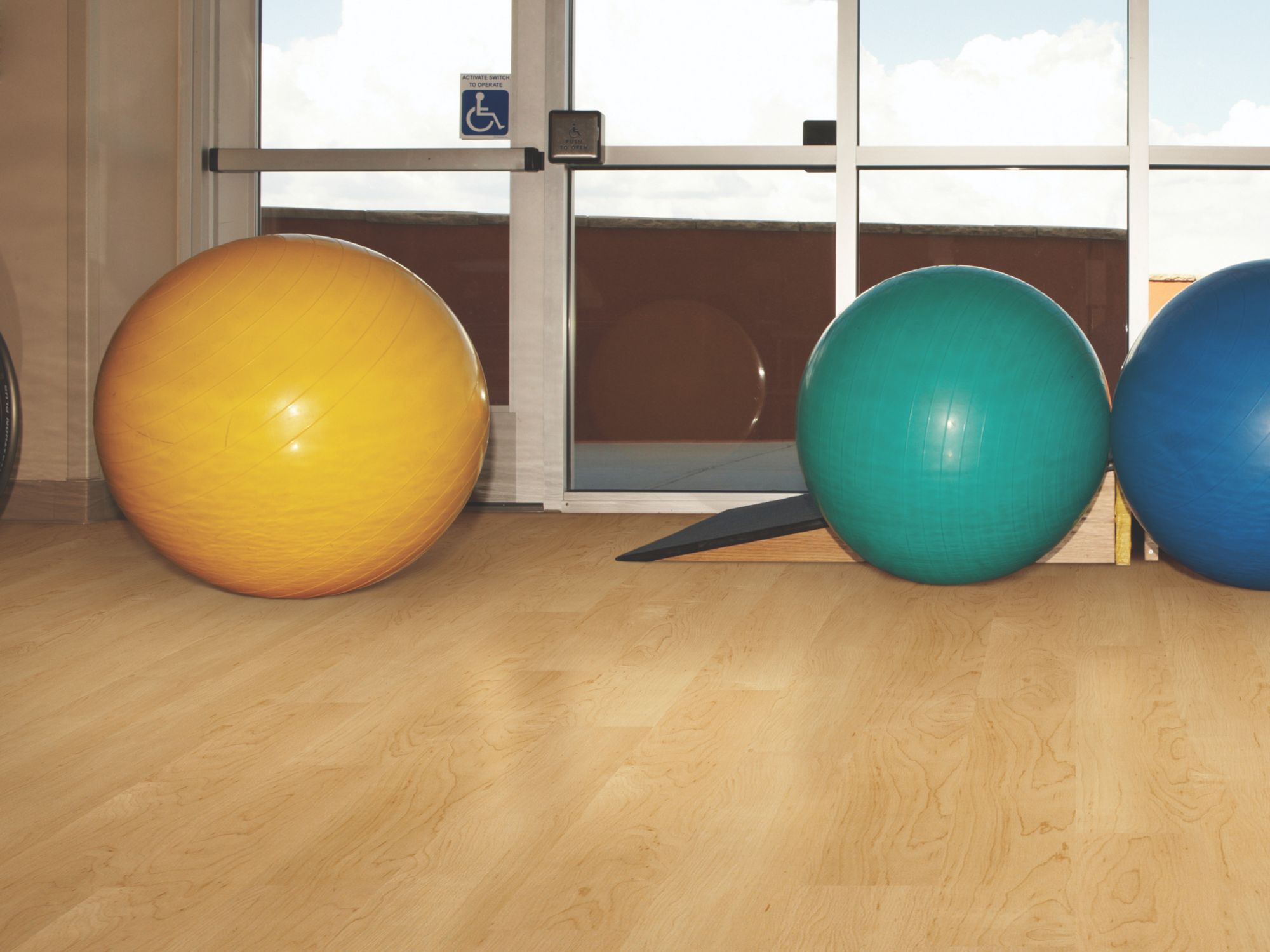 Bosk Pro Vinyl Commercial by Shaw Floors in the color Maple Select flooring in a home, showing the finished look.