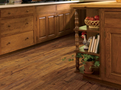 Wood Mix Vinyl Commercial by Shaw Floors in the color Hickory flooring in a home, showing the finished look.