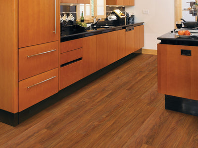 Wood Mix Vinyl Commercial by Shaw Floors in the color Sassafras flooring in a home, showing the finished look.