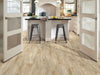 In The Park Vinyl Commercial by Shaw Floors in the color Latte flooring in a home, showing the finished look.