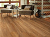 In The Park Vinyl Commercial by Shaw Floors in the color Teak flooring in a home, showing the finished look.