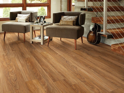 In The Park Sd Vinyl Commercial by Shaw Floors in the color Teak flooring in a home, showing the finished look.