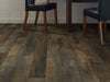 In The Grainii12  by Shaw Floors in the color Briarwood flooring in a home, showing the finished look.