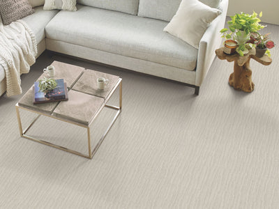 Calais Stil Residential Carpet by Shaw Floors in the color Ethereal. Image of beiges carpet in a room.