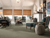 Truly Relaxed Loop Residential Carpet by Shaw Floors in the color Rocky Coast. Image of browns carpet in a room.